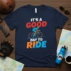 Navy blue t-shirt with "IT'S A GOOD DAY TO RIDE" text and a cyclist graphic