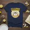 It's A Lemon Meringuin t-shirt featuring a cute penguin in a lemon meringue pie design