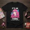 Black t-shirt featuring the quote "IT'S AN ANIME THING YOU WOULDN'T UNDERSTAND" with a pink-haired anime girl graphic