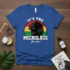 Blue t-shirt with text "IT'S THE MICROLOCS for me!" above a profile of a person with microlocs, set against a