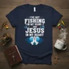 Christian fishing t-shirt with text "I've Got Fishing In My Veins And Jesus In My Heart" and praying hands graphic