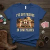 I've Got Friends In Low Places T-Shirt featuring three corgis playing poker in a western saloon setting