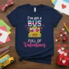 T-shirt with text "I've got a BUS FULL OF Valentines" and a cartoon school bus graphic with heart-shaped windows