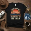 I've Got a Heart Like an Old Truck quote on a black t-shirt featuring a vintage blue pickup truck, desert