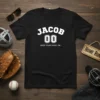 Black t-shirt with "JACOB 00 KEEP YOUR SHIRT ON" in white collegiate style font, baseball-themed design