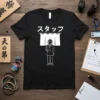 Black t-shirt with white Japanese text 'スタッフ' and a graphic of a person with a headset holding a clipboard