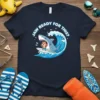 Shark surfing on a wave with text "Jaw Ready For This?" on a navy blue t-shirt
