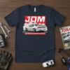 JDM Japanese Domestic Market t-shirt featuring a white Nissan S13 drifting with smoke, red JDM logo, and Japanese text