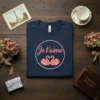 Navy t-shirt with "Je t'aime" in script and two pink swans forming a heart, within a white circle