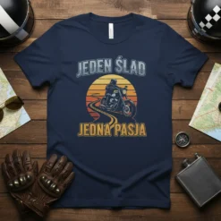Jeden ślad jedna pasja motorcycle t-shirt design with a biker riding on a road during sunset
