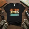 Retro "Jeffery Jeffery Jery" text design with orange, yellow, and teal colors on a black t-shirt
