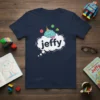 Navy t-shirt with 'jeffy' in a thought bubble, featuring a brain wearing a party hat and colorful geometric shapes