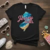 Jersey Girl t-shirt design featuring a map of New Jersey filled with ocean waves and sand, with pink text