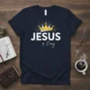 Jesus is King Christian T-Shirt with golden crown graphic and white typography on navy blue fabric