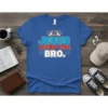 JESUS LOVES YOU, BRO. text with heart hands graphic on a blue t-shirt