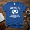 Blue t-shirt with white text "Jesus Loves You We Love Each Other Because He Loved Us First 1 John 4:19"