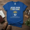 Blue Christian t-shirt with "Jesus Over Everything" text, crown, baby feet, and Ephesians scripture verse