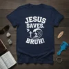 Navy t-shirt with white text "JESUS SAVES. BRUH!" featuring a cross, a dove, and a surfer on a wave graphic