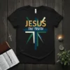 Jesus The Truth t-shirt with abstract cross design, featuring bold yellow and blue typography on a black background