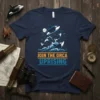 Join The Orca Uprising text with jumping killer whales graphic on a navy blue t-shirt