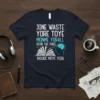 T-shirt with the quote JONE WASTE YORE TOYE MONME YORALL REDIII THE VOICE INSIDE MOYE YEDD, featuring an open book