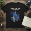 Journey To The Stars Explore The Universe Within t-shirt design with astronaut, galaxy, moon, and campfire graphic