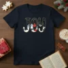Navy blue t-shirt with the word JOY designed with a winter mountain scene, pine trees, a cardinal, and a red