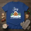 Christmas t-shirt with "Joy Hot Cocoa & Holiday Cheer" text, gingerbread house, ice skaters, and pine trees