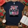 Joy to the World Christmas T-Shirt with festive typography and poinsettia graphic