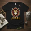 Black t-shirt featuring a bold lion graphic with the word "JUDAH" below for the JUDAH LION TRIBE