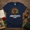 Juneteenth 1865 t-shirt with raised fist in red, green, and black, breaking chains, and sunburst