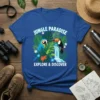 JUNGLE PARADISE EXPLORE & DISCOVER t-shirt with blue macaw, toucan, orange frog, and waterfall amidst tropical leaves