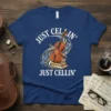 Just Cellin' Just Cellin' text with a cello on a stack of books and musical notes graphic on a navy