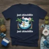 T-shirt with "just chinchillin just chinchillin" text and a cartoon chinchilla relaxing in a hammock under palm trees
