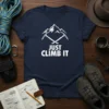 Navy t-shirt with white text "JUST CLIMB IT" above crossed ice axes and mountain graphic