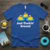 Blue t-shirt with white text "Just Duckin' Around" and three cartoon rubber ducks wearing sunglasses swimming in water