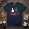 Navy t-shirt with "Just Feliz Navi Because I Don't Have A Dad" text, snowman, and Christmas tree graphic