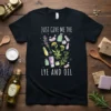 Black t-shirt with white text "JUST GIVE ME THE LYE AND OIL" and colorful soap making ingredients graphic