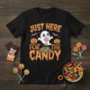 Black t-shirt with "JUST HERE FOR THE CANDY" text, featuring a cute ghost, pumpkins, bats, and a pile of candy