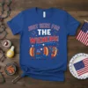 Just Here For The Wieners! text design with cartoon hot dogs grilling and celebrating on a blue t-shirt