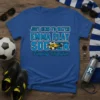 Blue t-shirt with text "Just Here to Watch Emma Play Soccer #12 Flagstaff Revolution" and soccer ball graphic