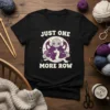 Black t-shirt with "JUST ONE MORE ROW" text and a purple octopus-like creature knitting yarn