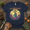 T-shirt with "Just zombie yourself" text and a cartoon zombie watering purple roses with pumpkin faces