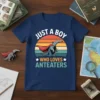 Retro sunset design with text "Just A Boy Who Loves Anteaters" and a cartoon anteater wearing a red cape