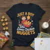 T-shirt design with text "JUST A BOY Who Loves Chicken NUGGETS" featuring a happy boy holding a chicken nugget and
