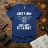 White text "JUST A BOY WHO LOVES CICADAS" with a cicada illustration on a navy blue t-shirt