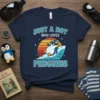 Just A Boy Who Loves Penguins t-shirt with a cartoon penguin wearing sunglasses on a surfboard