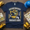 Navy t-shirt with yellow text and graphics of an excavator and dump truck, reading "JUST A BOY WHO LOVES TRUCKS