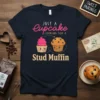 Just A Cupcake Looking For A Stud Muffin phrase with cute cupcake and muffin graphics on a navy t-shirt