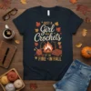 T-shirt with text "JUST A Girl who Crochets BY THE FIRE IN FALL" featuring a fireplace, yarn, and fall leaves